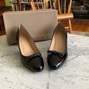 Black paten  leather heels.